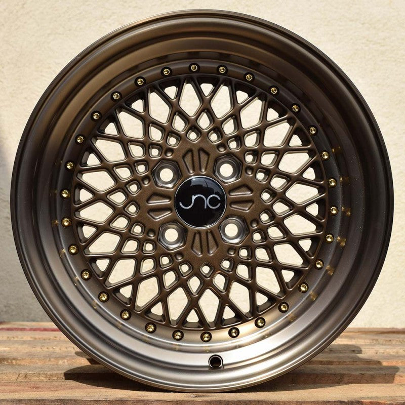 JNC045 Machined Bronze w/ Gold Rivets wheel